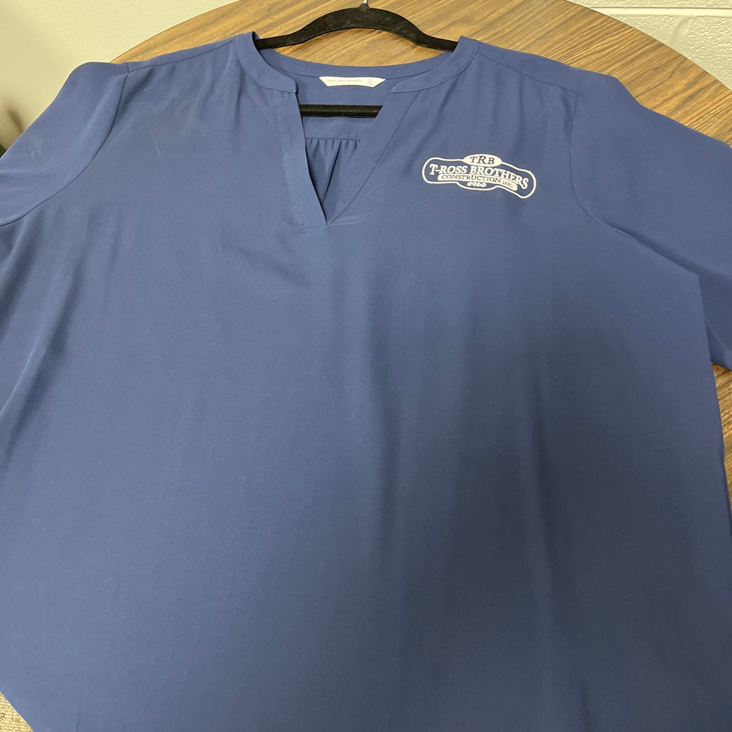 T-Ross Brothers Construction Women’s Performance V-Neck Top - Blue