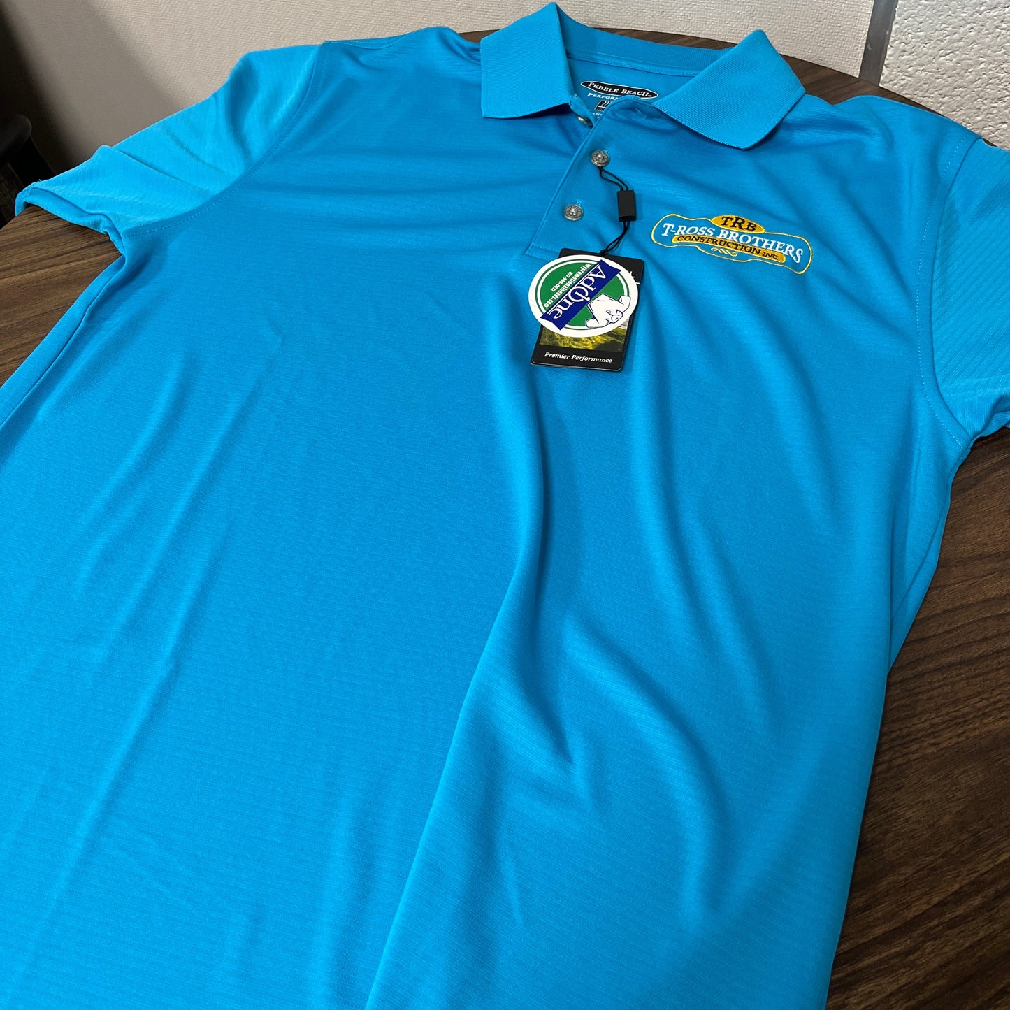 T-Ross Brothers Construction Performance Polo – Ocean Blue